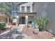 Inviting home with a cozy front porch and xeriscaped front yard at 45176 W Alamendras St, Maricopa, AZ 85139