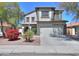 Inviting two-story home featuring a well-manicured lawn and attached two-car garage at 45176 W Alamendras St, Maricopa, AZ 85139