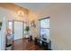 Inviting foyer with high ceilings and stylish lighting fixture at 45176 W Alamendras St, Maricopa, AZ 85139
