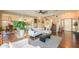 Bright living room featuring a ceiling fan and an open floorplan at 45176 W Alamendras St, Maricopa, AZ 85139
