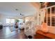Open-concept living room with hardwood floors and staircase at 45176 W Alamendras St, Maricopa, AZ 85139