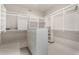 Walk-in closet with custom shelving, drawers, hanging space, and tile flooring at 5140 S Tanglewood Dr, Chandler, AZ 85248