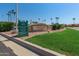 Ironwood clubhouse entrance with well-manicured lawn and signage for 'Grill on the Green' events at 5140 S Tanglewood Dr, Chandler, AZ 85248