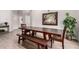A neutral dining room featuring hardwood floors, a large dining table, and desert decor at 5140 S Tanglewood Dr, Chandler, AZ 85248