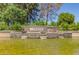 Community entrance with attractive water feature, landscaping, and decorative 