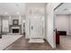 Spacious foyer with wood floors, a fireplace, and a view into the living room at 5140 S Tanglewood Dr, Chandler, AZ 85248