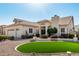 Charming home exterior featuring desert landscaping and a perfectly manicured circular grass area at 5140 S Tanglewood Dr, Chandler, AZ 85248