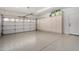 Clean and spacious garage featuring epoxied flooring and built-in storage cabinets at 5140 S Tanglewood Dr, Chandler, AZ 85248