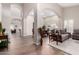 Open-concept living room featuring hardwood floors and an archway into the dining area at 5140 S Tanglewood Dr, Chandler, AZ 85248