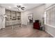 Office with built-in shelving, hard floors, ceiling fan, and lots of natural light at 5140 S Tanglewood Dr, Chandler, AZ 85248