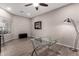 Bright office with a ceiling fan, hard flooring, and glass computer desk at 5140 S Tanglewood Dr, Chandler, AZ 85248