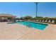 Community pool with poolside seating, spa, and shade structure for relaxation at 5140 S Tanglewood Dr, Chandler, AZ 85248