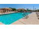 Community pool with poolside seating, spa, and shade structure for relaxation at 5140 S Tanglewood Dr, Chandler, AZ 85248
