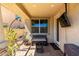 Cozy covered back patio featuring a bench, hanging chair, and outdoor TV at 5259 S Hadron --, Mesa, AZ 85212