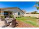 Outdoor brick patio with dining area and well-manicured lawn surrounded by greenery at 5259 S Hadron --, Mesa, AZ 85212