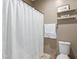 Cozy bathroom with a white shower curtain, open shelves and essential toiletries at 5259 S Hadron --, Mesa, AZ 85212