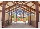 Open-air community space with metal beams, seating and landscaping at 5259 S Hadron --, Mesa, AZ 85212