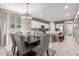 Elegant dining area with chandelier, decorative table, and open layout to the kitchen at 5259 S Hadron --, Mesa, AZ 85212