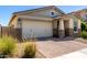 Charming single-story home featuring a brick driveway, a two-car garage, and desert landscaping at 5259 S Hadron --, Mesa, AZ 85212