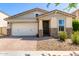 Charming single-story home with stone accents, desert landscaping and a two car garage at 5259 S Hadron --, Mesa, AZ 85212