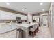 Modern kitchen with white cabinets, a center island, stainless steel appliances and tile flooring at 5259 S Hadron --, Mesa, AZ 85212