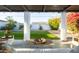 Picturesque backyard view from the covered patio, showcasing a lush lawn and vibrant flowers at 536 W Windsor Ave, Phoenix, AZ 85003