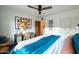 A spacious bedroom with stylish furnishings, natural light, and a ceiling fan at 536 W Windsor Ave, Phoenix, AZ 85003