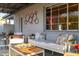 Relaxing covered patio with a comfortable sofa, accent pillows, and outdoor decor, perfect for entertaining at 536 W Windsor Ave, Phoenix, AZ 85003