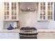 Close-up of a modern gas cooktop and oven in a kitchen with white subway tile and granite countertops at 536 W Windsor Ave, Phoenix, AZ 85003
