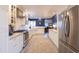 Bright eat-in kitchen with stainless appliances, granite counters, and custom cabinetry at 536 W Windsor Ave, Phoenix, AZ 85003