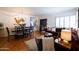 Inviting living room featuring a comfortable sofa, stylish decor, and hardwood flooring at 536 W Windsor Ave, Phoenix, AZ 85003