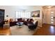 Cozy living room with shuttered windows, a plush sectional sofa, and neutral-toned decor at 536 W Windsor Ave, Phoenix, AZ 85003