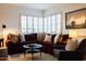 Comfortable living room area showcasing ample natural light, plush seating, and stylish decor at 536 W Windsor Ave, Phoenix, AZ 85003