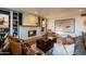 Spacious living room with a brick fireplace, built-in shelving, and comfortable seating arrangement at 536 W Windsor Ave, Phoenix, AZ 85003
