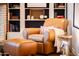 Comfortable sitting area with leather chair, ottoman, built-in shelves and ample reading light at 536 W Windsor Ave, Phoenix, AZ 85003