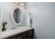 Powder room with a vanity, sink, and decorative mirror at 8554 E Mcdonald Dr, Scottsdale, AZ 85250