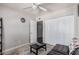 Bedroom featuring a ceiling fan, carpet, and view into hallway at 8554 E Mcdonald Dr, Scottsdale, AZ 85250