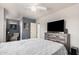 Comfortable bedroom featuring a ceiling fan, dresser, and television at 8554 E Mcdonald Dr, Scottsdale, AZ 85250