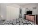 Comfortable bedroom with patterned bedding, and dark wood dresser at 8554 E Mcdonald Dr, Scottsdale, AZ 85250