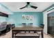 Sunlit dining space showcasing a sleek table set, accented with colorful cactus-themed wall art at 8554 E Mcdonald Dr, Scottsdale, AZ 85250