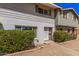 Charming townhome with a well-maintained facade, neutral paint, and front yard landscaping at 8554 E Mcdonald Dr, Scottsdale, AZ 85250