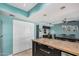 Modern kitchen showcasing a large island and stylish design seamlessly connecting dining and desk area at 8554 E Mcdonald Dr, Scottsdale, AZ 85250