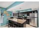 Stylish kitchen featuring a breakfast bar, modern appliances, and functional layout at 8554 E Mcdonald Dr, Scottsdale, AZ 85250