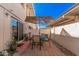 Charming patio with an umbrella-covered table, ideal for outdoor dining and relaxation at 8554 E Mcdonald Dr, Scottsdale, AZ 85250