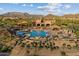 Aerial view of the expansive community pool area, highlighting its size, amenities, and desert backdrop at 8661 E Ivy St, Mesa, AZ 85207