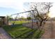 Backyard with a swing set and seating under the shade trees at 9732 N Penworth Dr, Casa Grande, AZ 85122