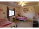 Bedroom with two beds, study space, and pink decor at 9732 N Penworth Dr, Casa Grande, AZ 85122