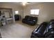 Bedroom with mirrored closet and black leather reclining furniture at 9732 N Penworth Dr, Casa Grande, AZ 85122