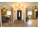 Open entryway showcases an arched doorway leading to dining area and an office space at 9732 N Penworth Dr, Casa Grande, AZ 85122