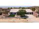 Wonderful desert home with an attached garage, and a delightful front patio and green lawn at 9732 N Penworth Dr, Casa Grande, AZ 85122